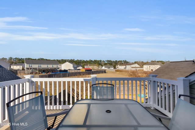 wooden terrace featuring a residential view