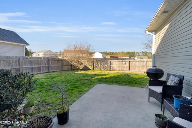 view of yard featuring a fenced backyard and a patio