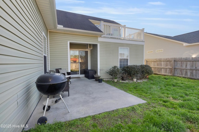 view of patio / terrace featuring fence, a balcony, and grilling area