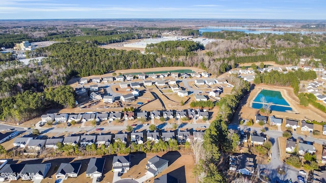 birds eye view of property featuring a residential view and a water view