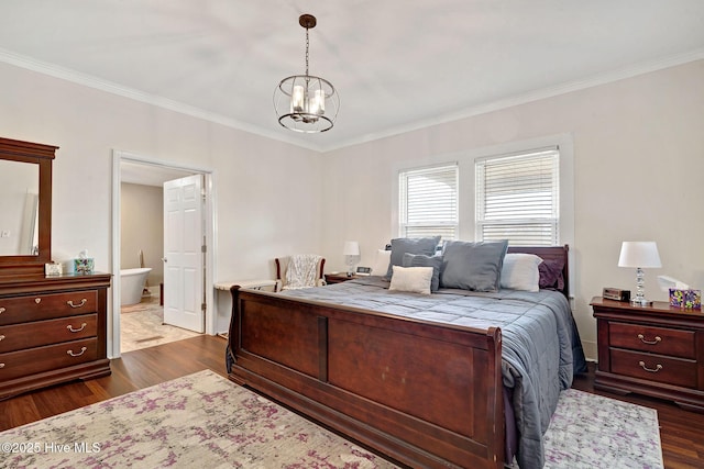 bedroom with ornamental molding, dark wood-style flooring, connected bathroom, and an inviting chandelier