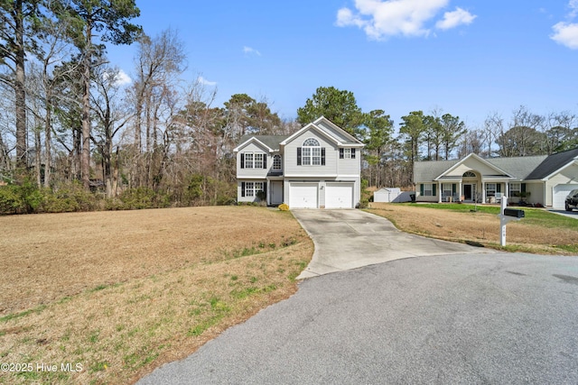 view of front of home with driveway, a garage, a porch, and a front yard