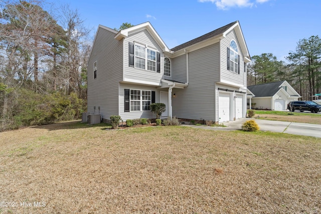 traditional-style house featuring a garage, central AC unit, a front lawn, and concrete driveway