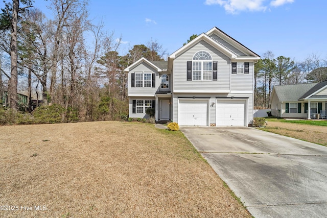 view of front facade with a garage, concrete driveway, and a front yard