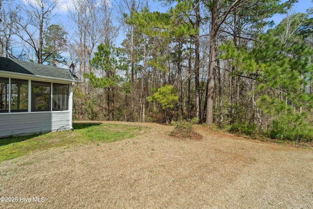 view of yard featuring a sunroom