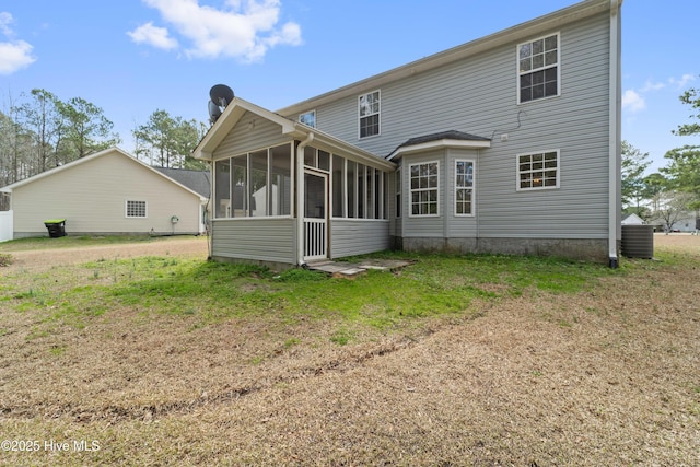 back of house featuring a sunroom