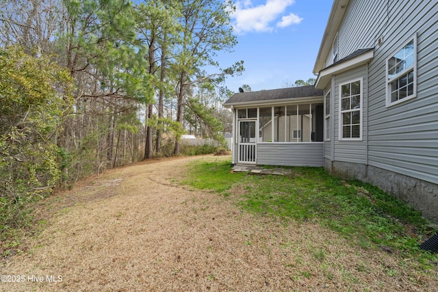 view of yard featuring a sunroom