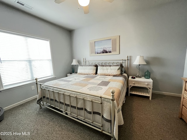 carpeted bedroom with baseboards, visible vents, and ceiling fan