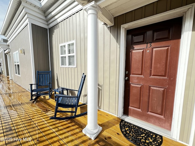 entrance to property featuring board and batten siding