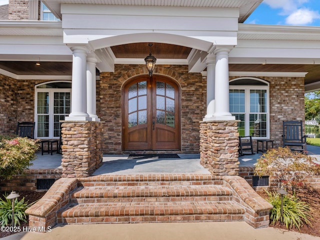 property entrance featuring covered porch