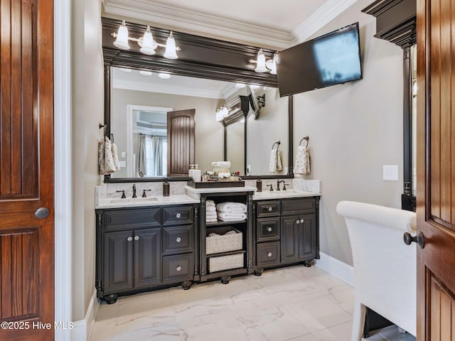 bathroom with double vanity, ornamental molding, marble finish floor, and a sink