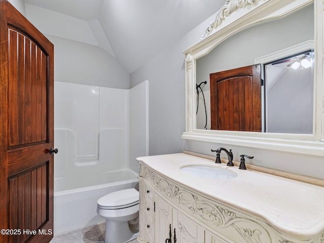 full bathroom featuring vanity, lofted ceiling, toilet, and bathing tub / shower combination