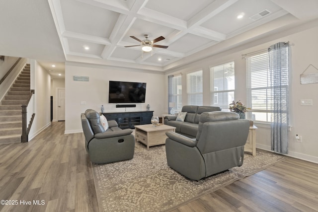 living room featuring stairs, wood finished floors, visible vents, and coffered ceiling