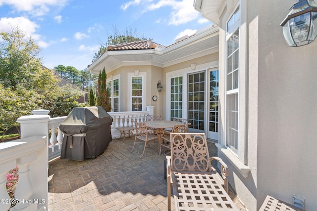 view of patio with outdoor dining space and area for grilling