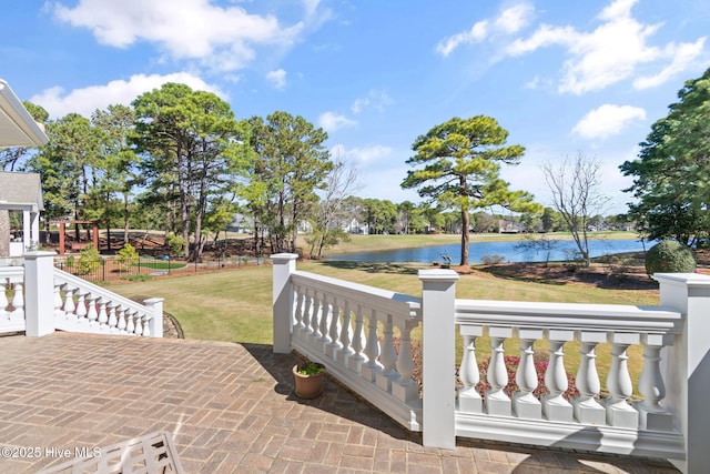 view of patio / terrace featuring a water view and a porch