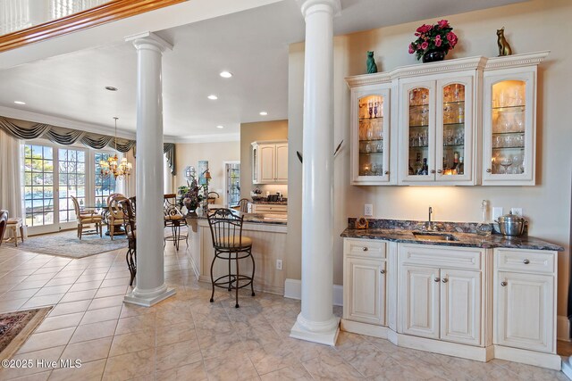 2760 Marsh Point Ln SE, Southport, NC 28461 - indoor wet bar featuring decorative columns and recessed lighting