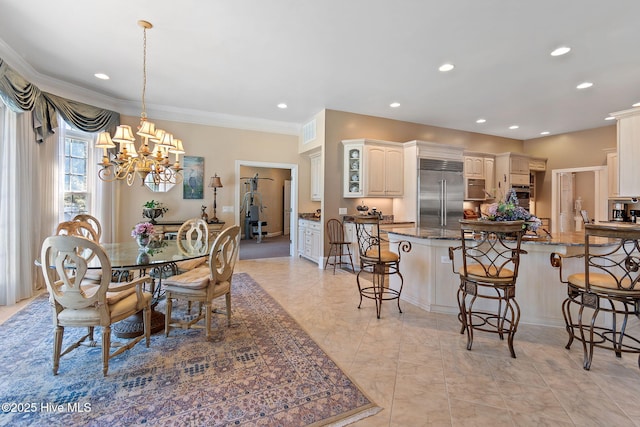 dining space with a chandelier, ornamental molding, and recessed lighting