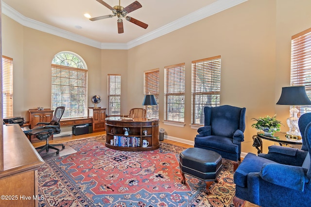 office featuring wood finished floors, ceiling fan, crown molding, and baseboards