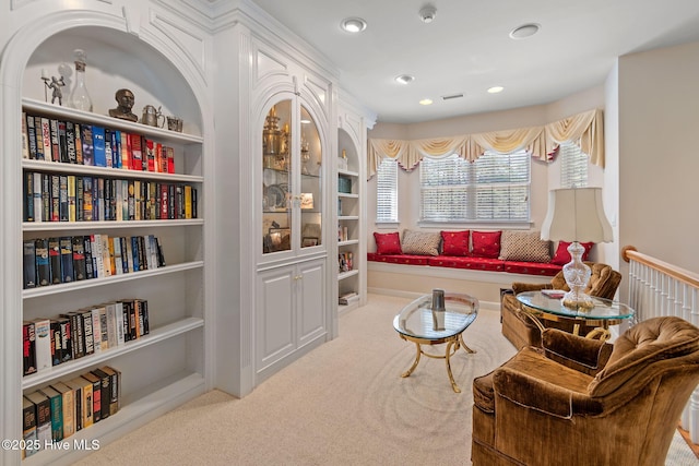 living area with carpet floors and recessed lighting