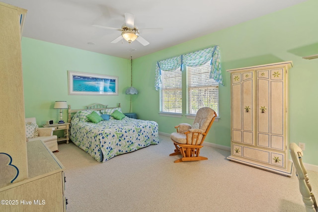 bedroom with carpet floors, baseboards, and a ceiling fan