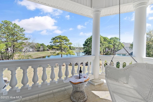 balcony featuring a water view