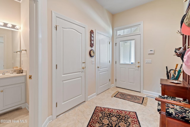 foyer entrance with baseboards