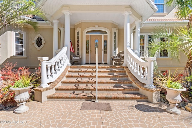 doorway to property featuring a porch