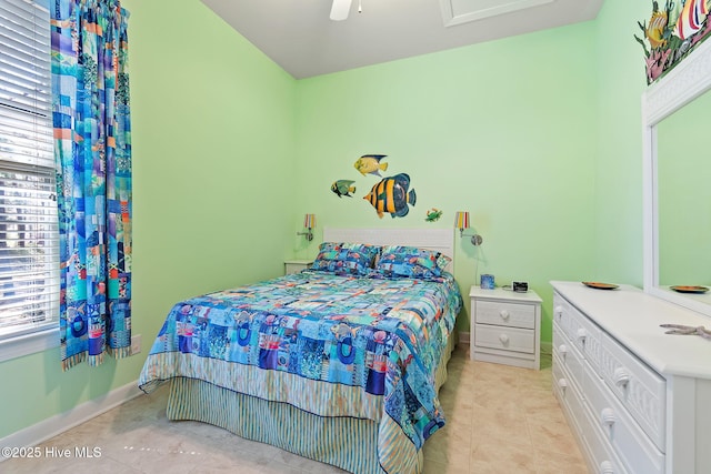 bedroom featuring light tile patterned flooring, baseboards, and ceiling fan