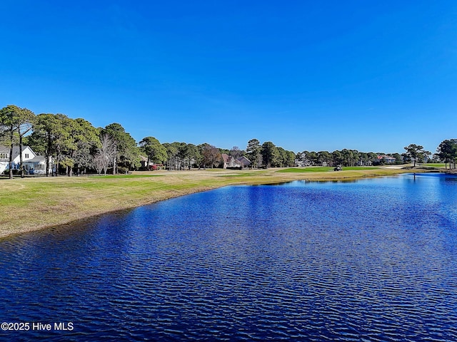 water view featuring a tree filled landscape