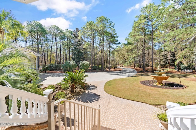 surrounding community featuring view of wooded area