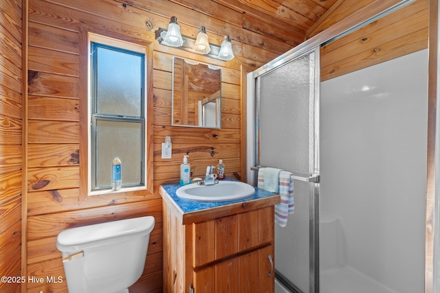 full bath with vanity, a shower stall, wooden walls, and toilet