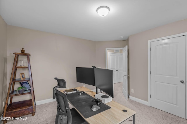 office area with baseboards and light colored carpet