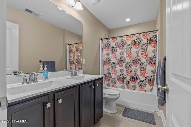 bathroom with visible vents, a sink, toilet, and tile patterned floors