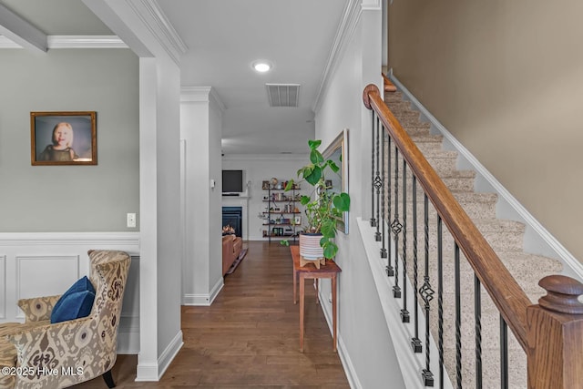 hallway featuring recessed lighting, dark wood-style flooring, visible vents, stairs, and crown molding