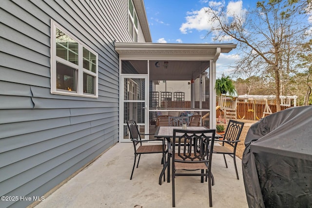 view of patio featuring outdoor dining space and fence