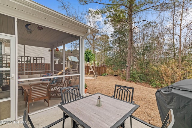 view of patio with outdoor dining space, a fenced backyard, and area for grilling