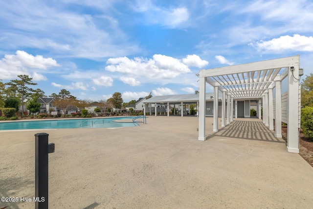 pool featuring a pergola and a patio