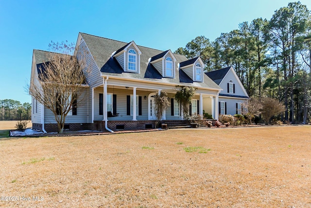 cape cod house featuring crawl space, a front lawn, and a porch