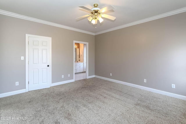 empty room with carpet floors, crown molding, baseboards, and ceiling fan