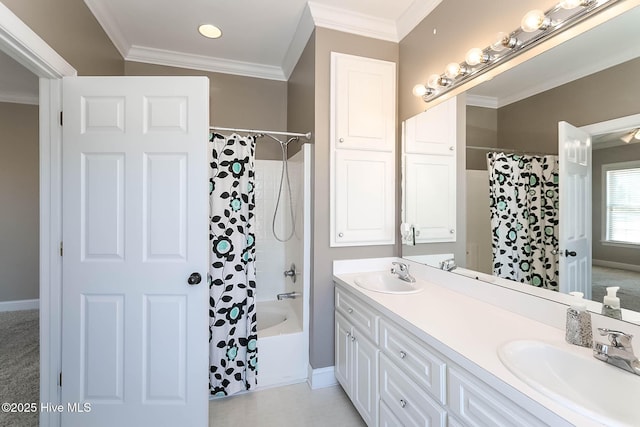 full bathroom featuring ornamental molding, a sink, and double vanity