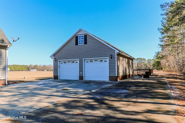 view of property exterior featuring a garage and an outdoor structure