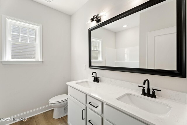 4506 Fairhaven Dr W, Wilson, NC 27893 - full bath with double vanity and wood finished floors