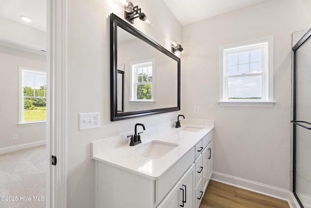 4506 Fairhaven Dr W, Wilson, NC 27893 - bathroom with plenty of natural light, double vanity, and a shower with shower door