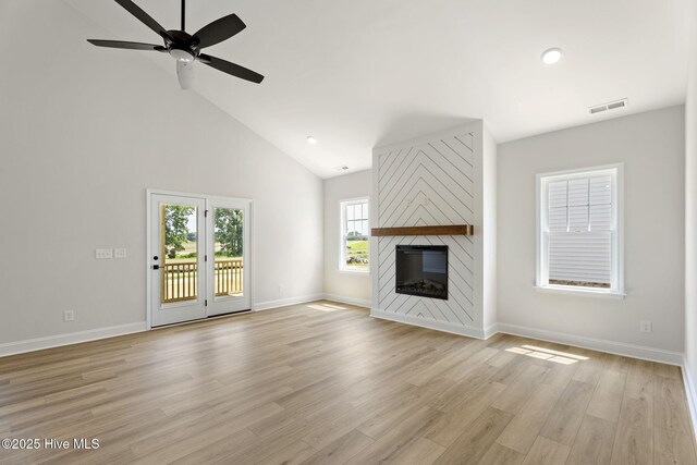 4506 Fairhaven Dr W, Wilson, NC 27893 - unfurnished living room featuring a ceiling fan, a large fireplace, high vaulted ceiling, light wood finished floors, and recessed lighting