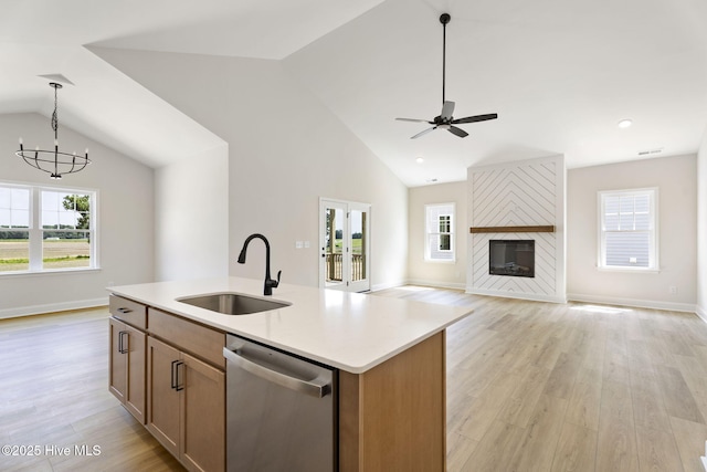 4506 Fairhaven Dr W, Wilson, NC 27893 - kitchen with dishwasher, vaulted ceiling, a chandelier, light wood-style floors, and hanging light fixtures