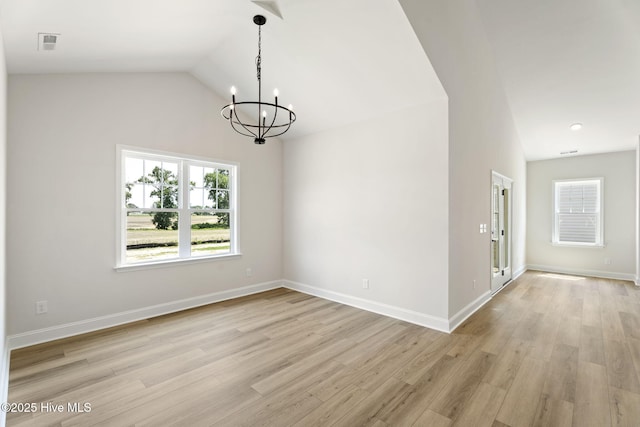 4506 Fairhaven Dr W, Wilson, NC 27893 - unfurnished dining area featuring a chandelier, light wood-type flooring, and lofted ceiling