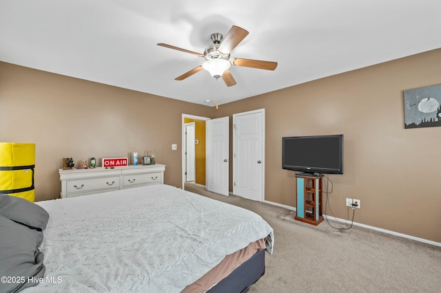 bedroom with carpet, baseboards, and a ceiling fan