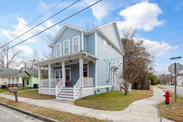 view of front facade with covered porch and crawl space