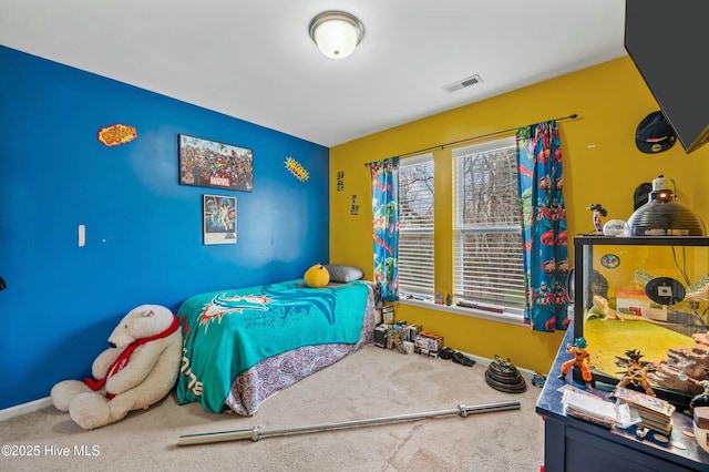 bedroom with baseboards, visible vents, and carpet flooring