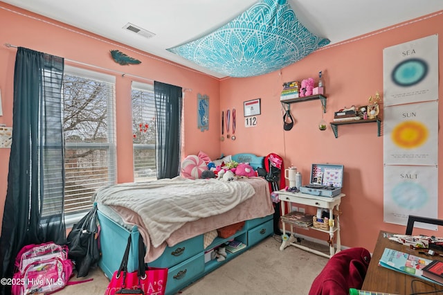 bedroom with visible vents and carpet flooring